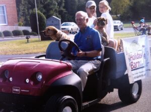 man, dogs, kids in ATV